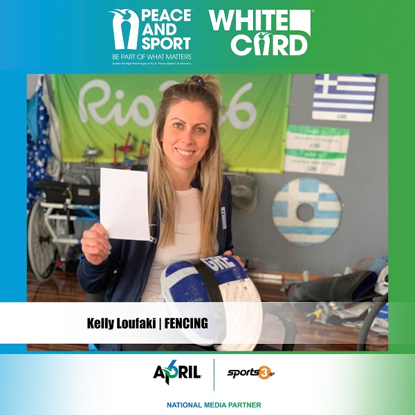 Kelly Loufaki raises the White Card for the “Peace and Sport” movement, giving a message for world peace.